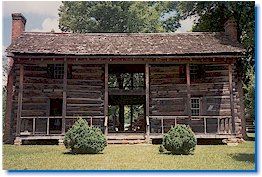 Face of a very old log cabin.